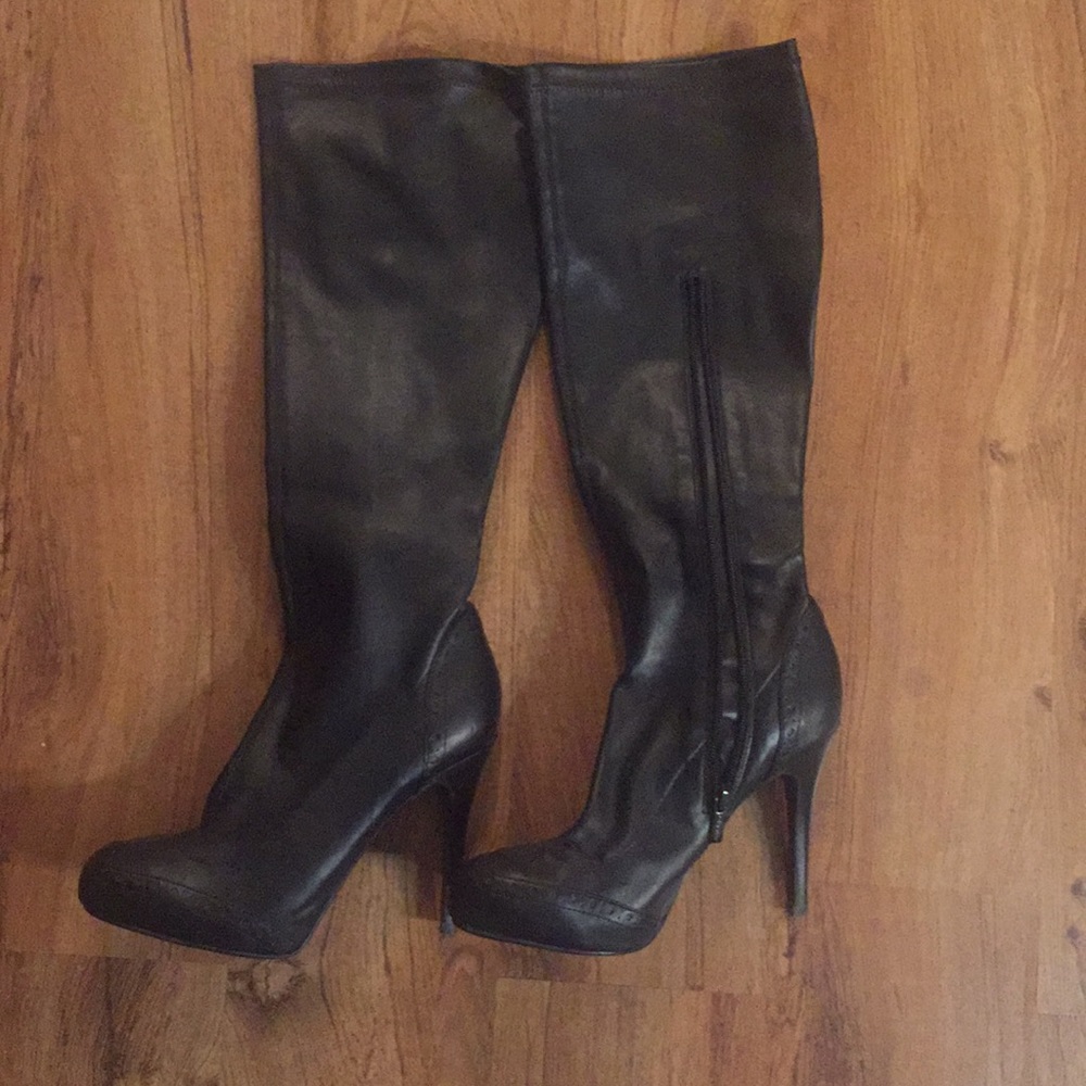 Knee-high, leather stiletto boots, never worn.